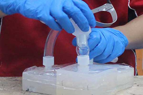 Filling tubes being added to a silicone vacuum casting mold at Star Rapid