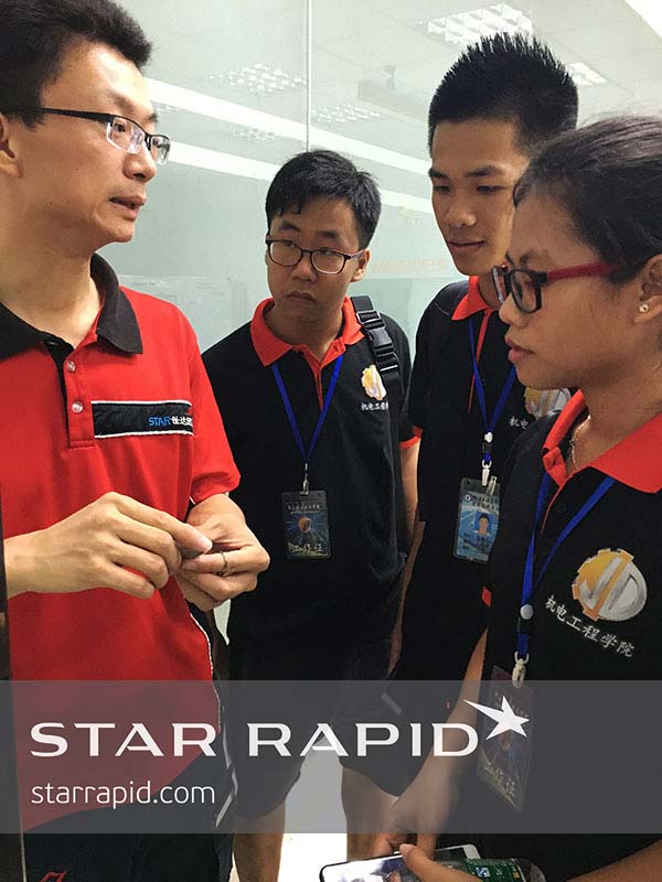 Young engineering graduates taking a factory tour at Star Rapid