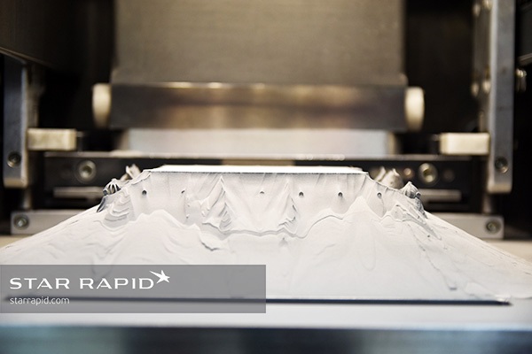Excess powder on the build plate of Star Rapid's 3D metal printer
