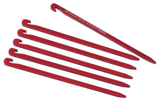 Several red aluminum tent stakes or pegs made of high-strength 7075 alloy