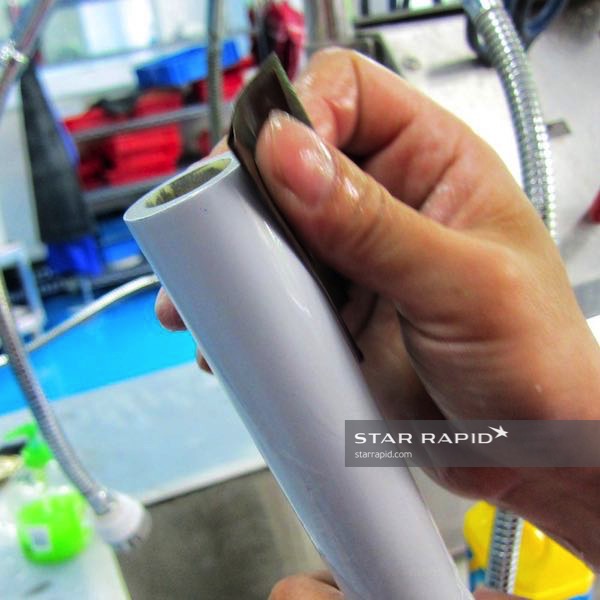 Hand finishing the primed ABS material